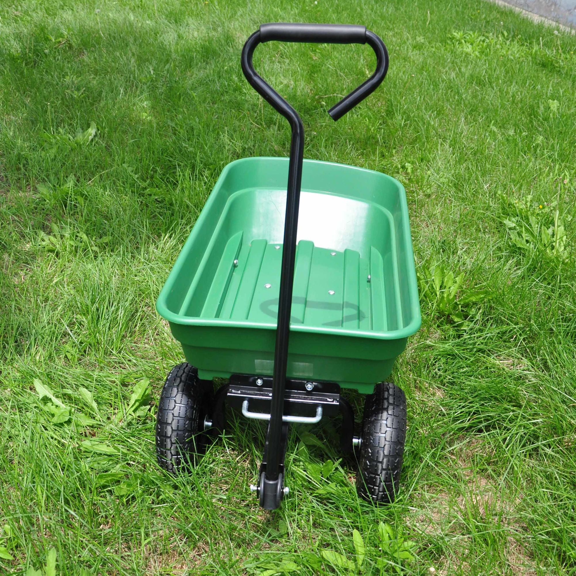 Poly Garden Dump Cart with steel frame and 10-inch pneumatic tires, designed for heavy loads and easy maneuverability.