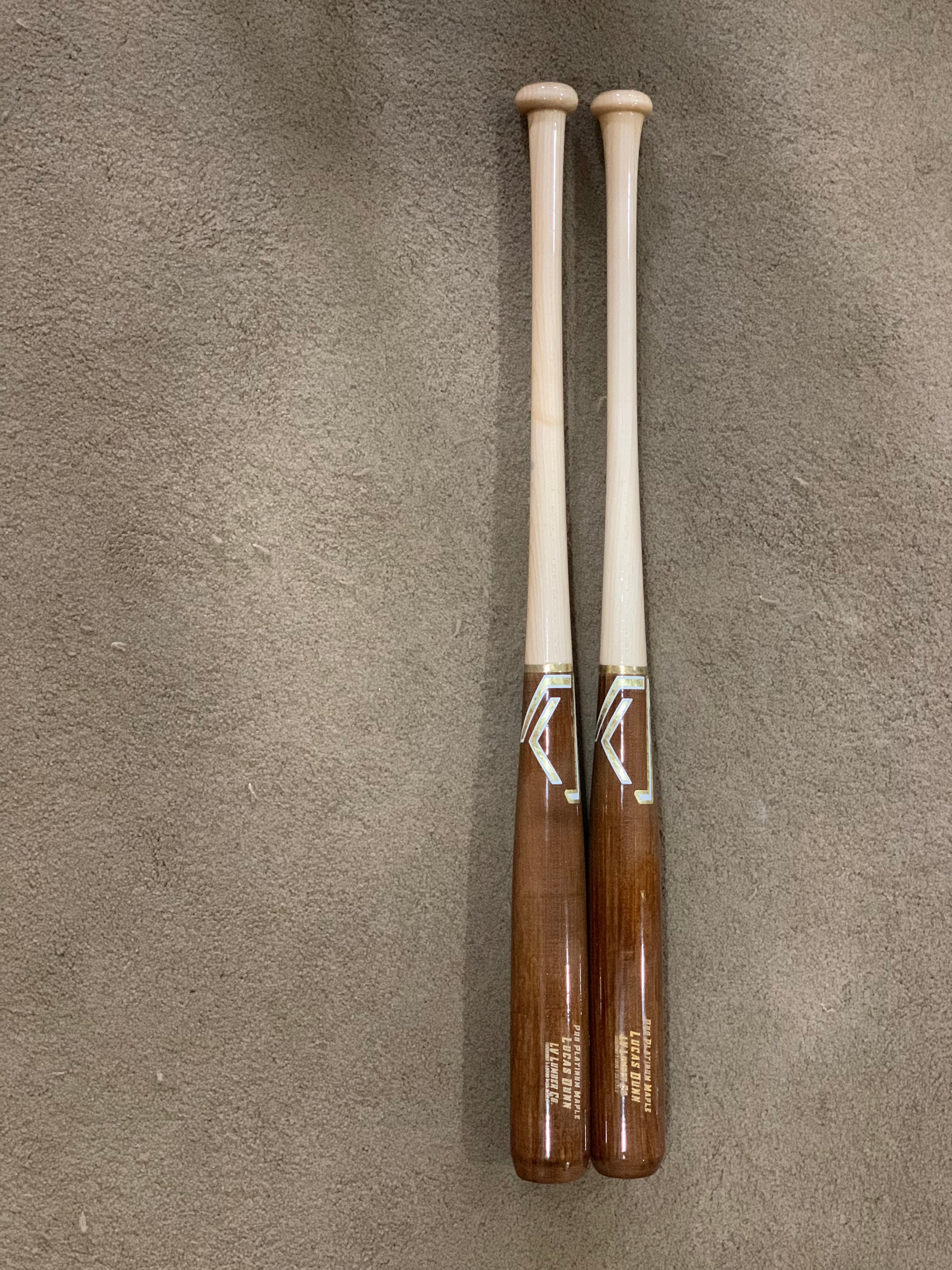 Half LV Heavy/Light Training Bats Set featuring one heavy bat and one light bat, handcrafted from quality wood for optimal training.