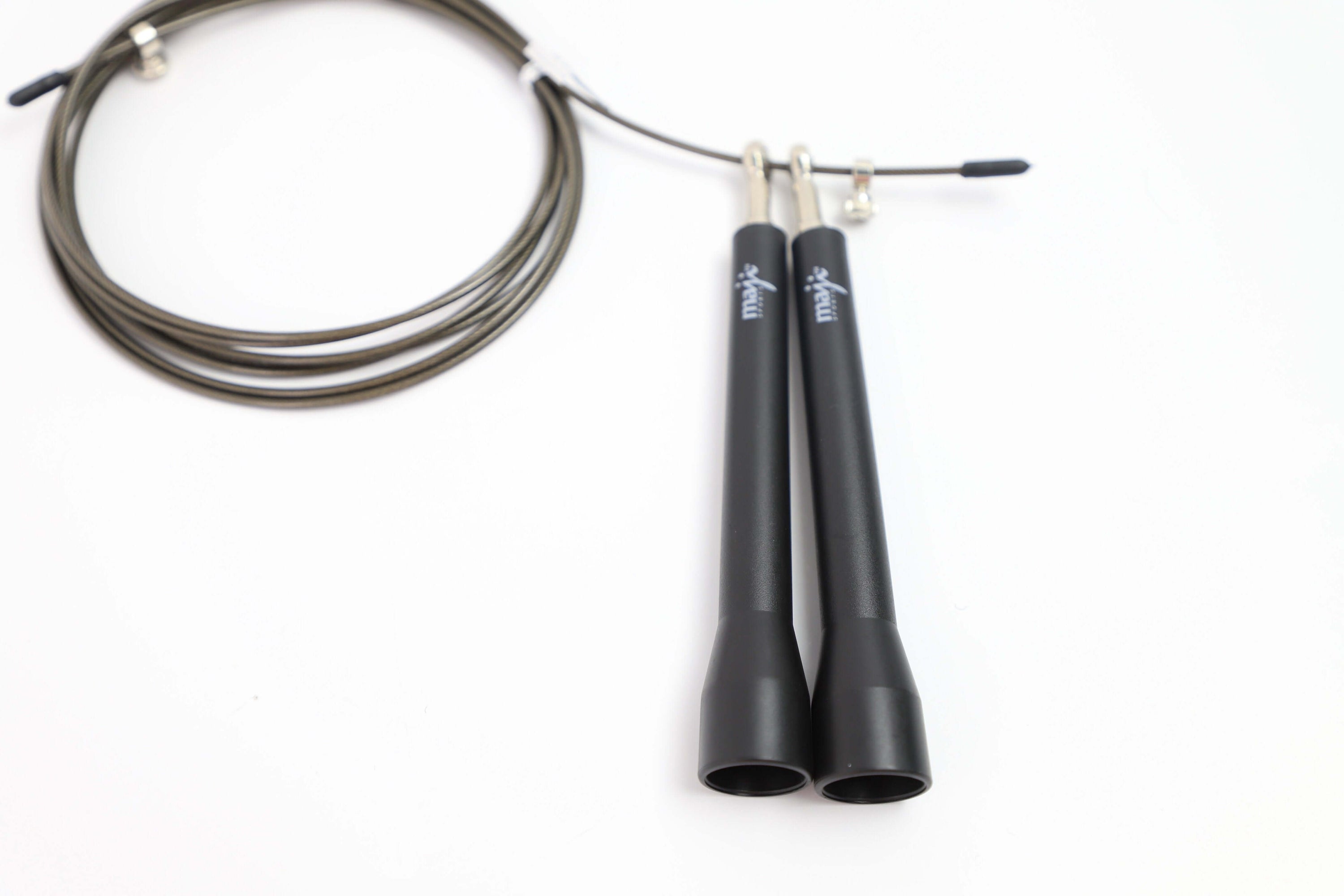 High Speed Jump Rope with lightweight PP handles, designed for fast and efficient cardio workouts, featuring a durable PVC coated steel cable.