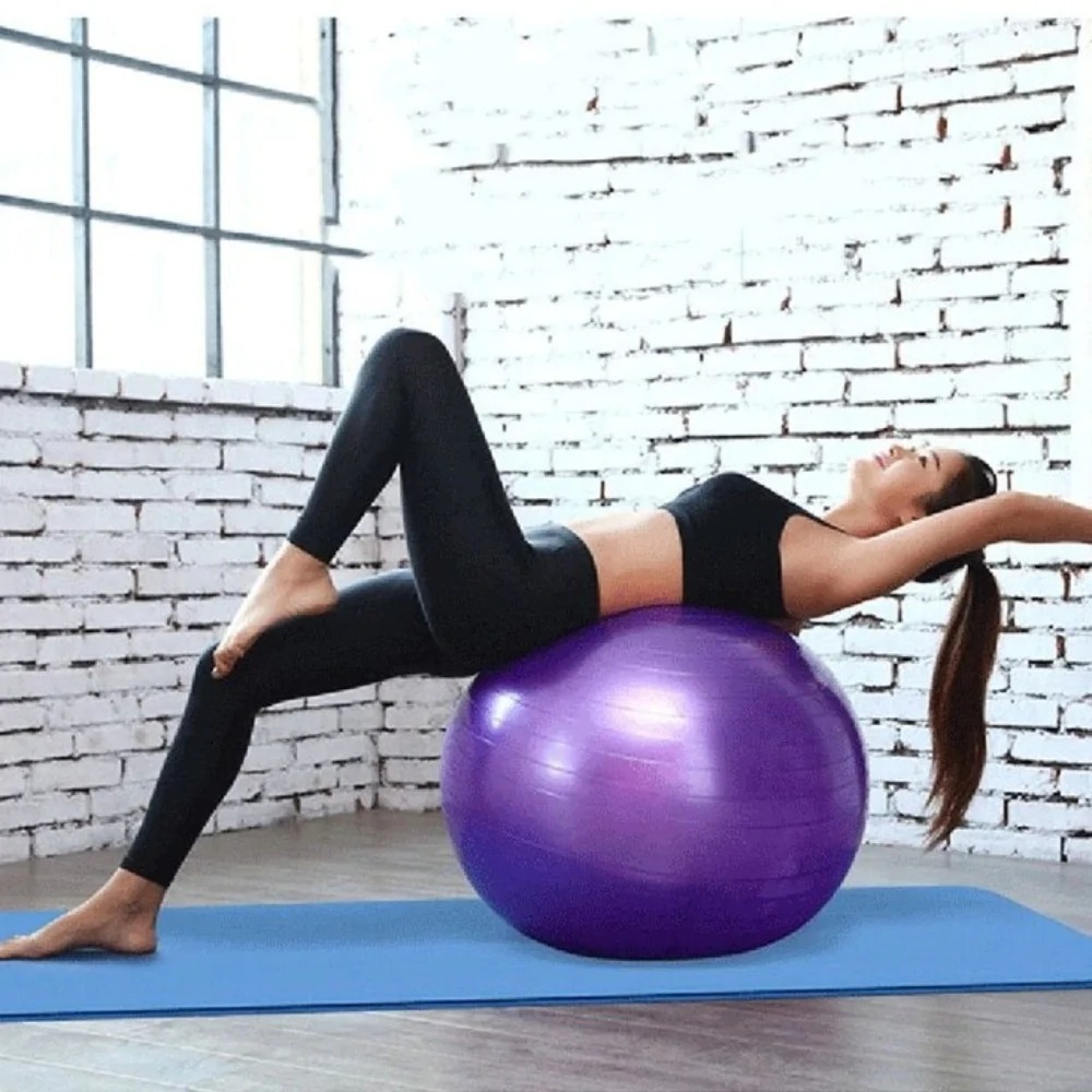 A vibrant Home Exercise Fitness Yoga Ball in blue, pink, and purple colors, ideal for core strength and balance training.