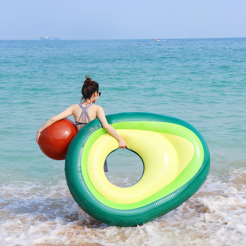 A vibrant inflatable giant avocado pool float, perfect for summer fun, showcasing its bright green and yellow colors.