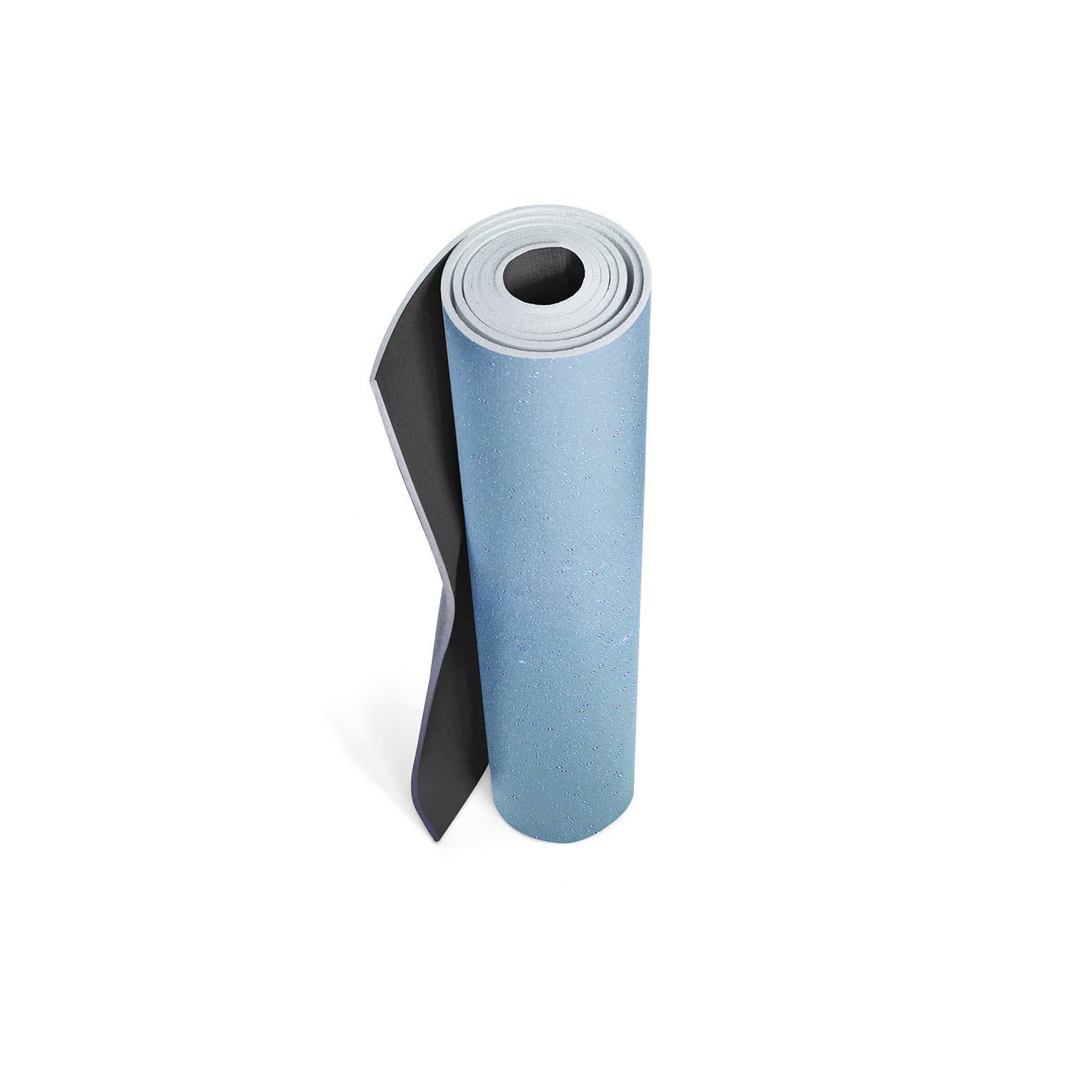 Maple Trekk Travel Yoga Mat in a serene outdoor setting, showcasing its eco-friendly design and textured surface.