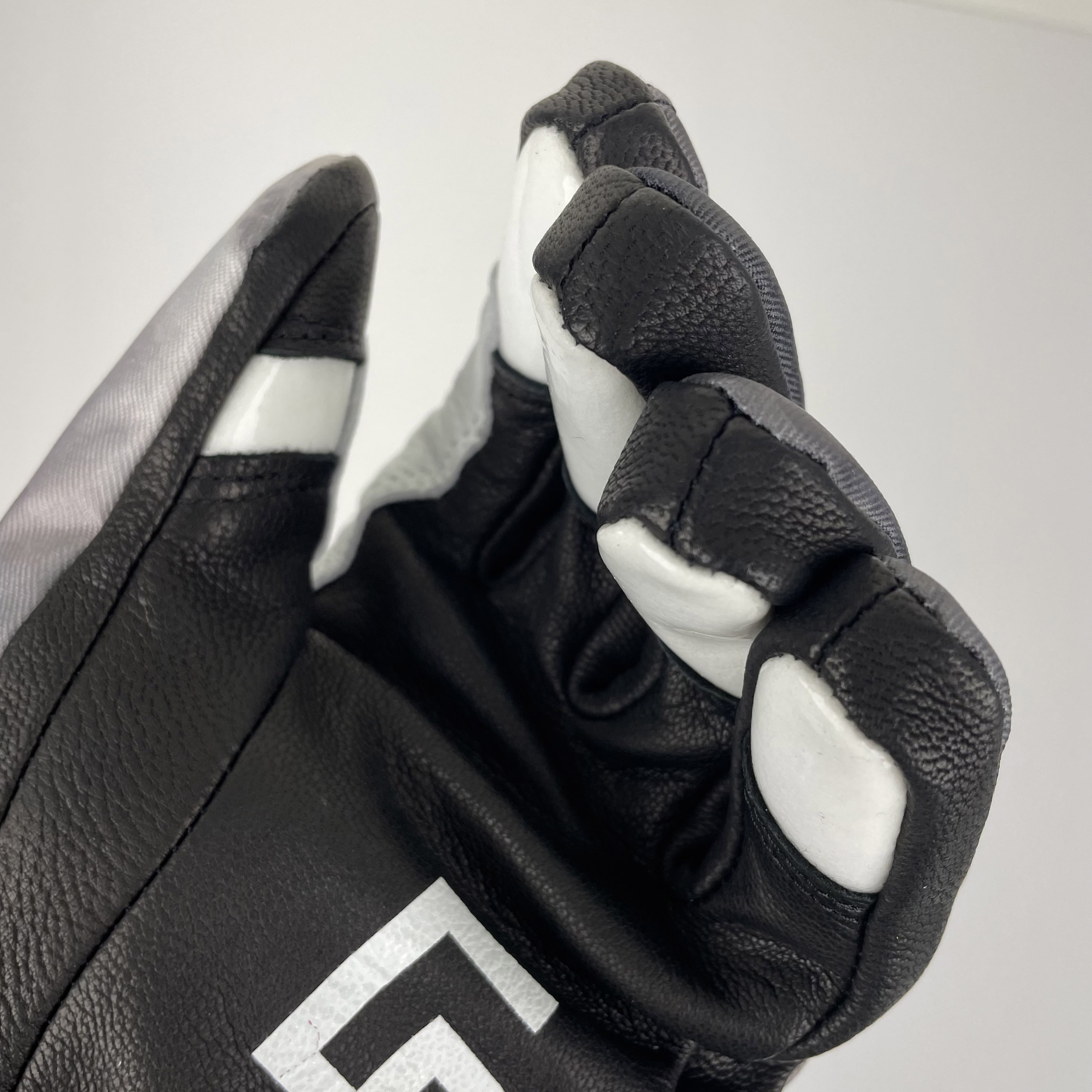 A pair of Park Gloves featuring genuine leather and a breathable waterproof membrane, designed for snowboarding in various conditions.