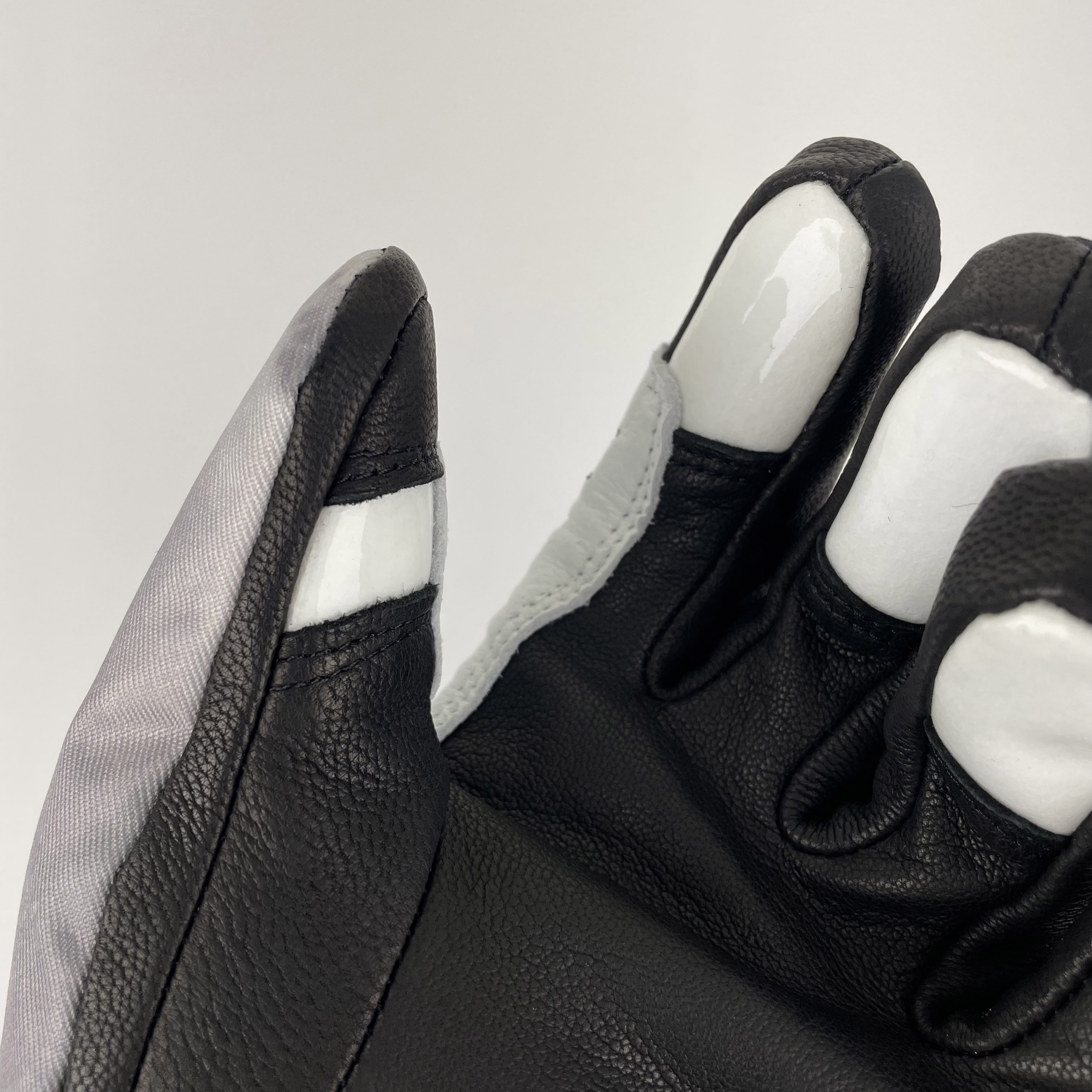 A pair of Park Gloves featuring genuine leather and a breathable waterproof membrane, designed for snowboarding in various conditions.