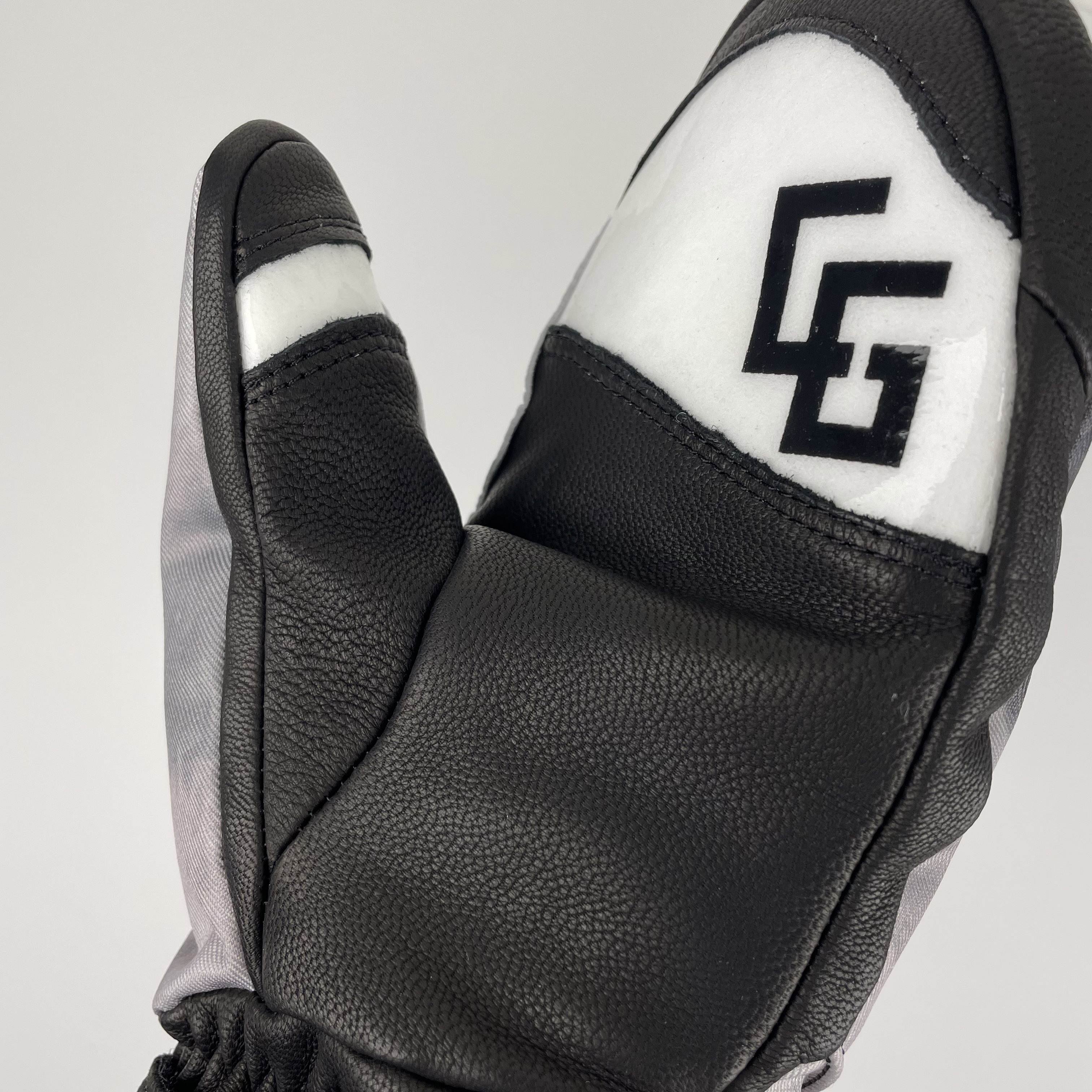 A pair of Park Mittens showcasing genuine leather and polyester twill outer shell, designed for snowboarding with a breathable waterproof membrane.