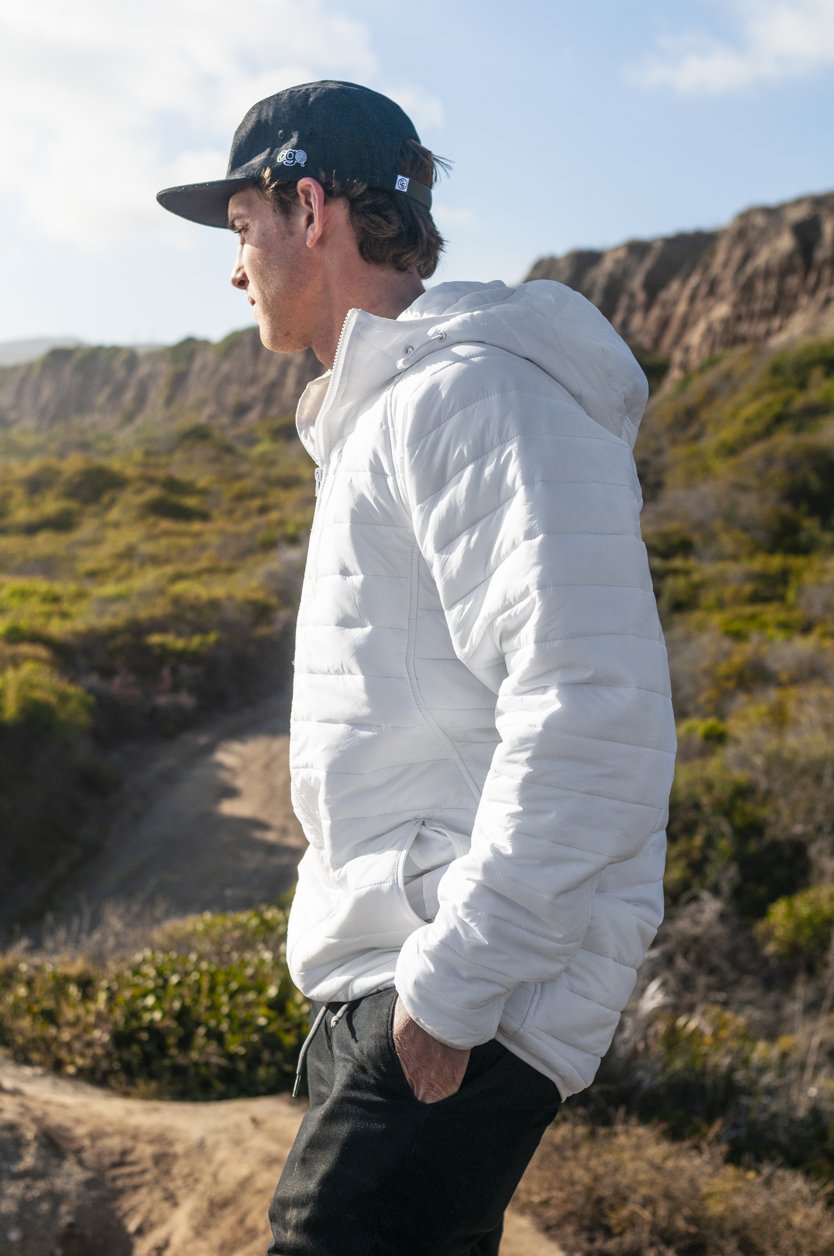 A cozy Sleeping Bag Hoodie made from DWR coated microfiber nylon, featuring an adjustable hood, zippered pockets, and a stylish design for outdoor adventures.