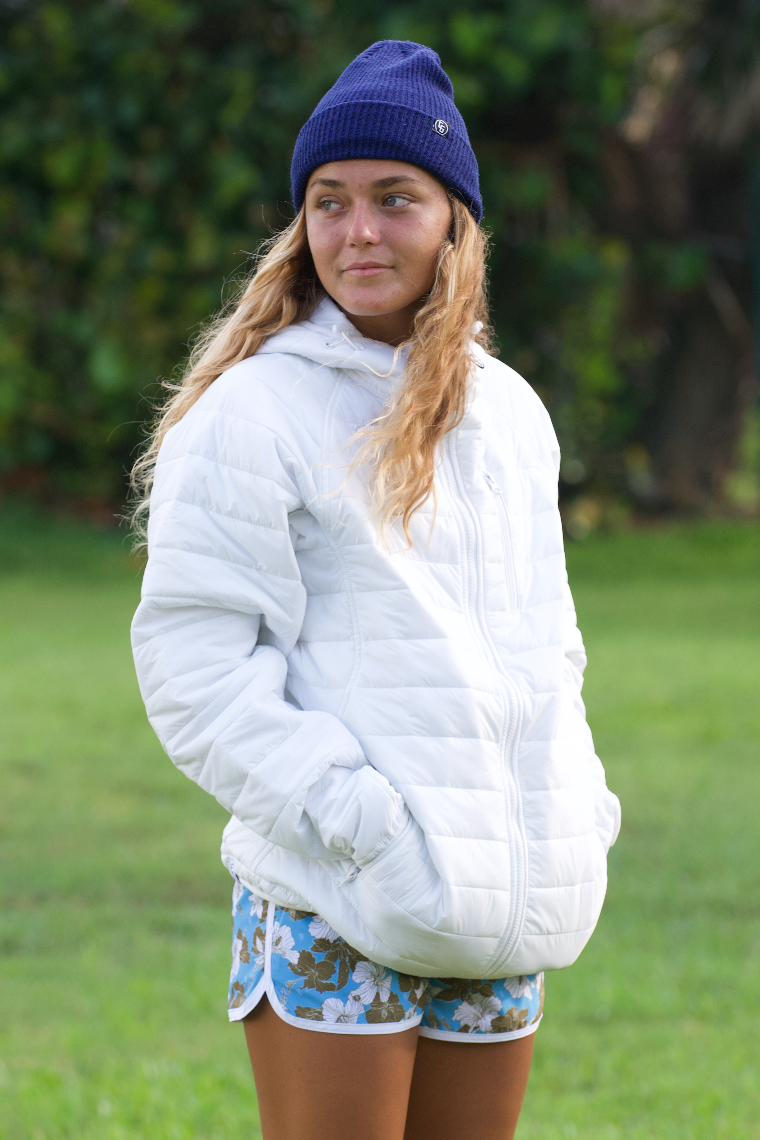 A cozy Sleeping Bag Hoodie made from DWR coated microfiber nylon, featuring an adjustable hood, zippered pockets, and a stylish design for outdoor adventures.