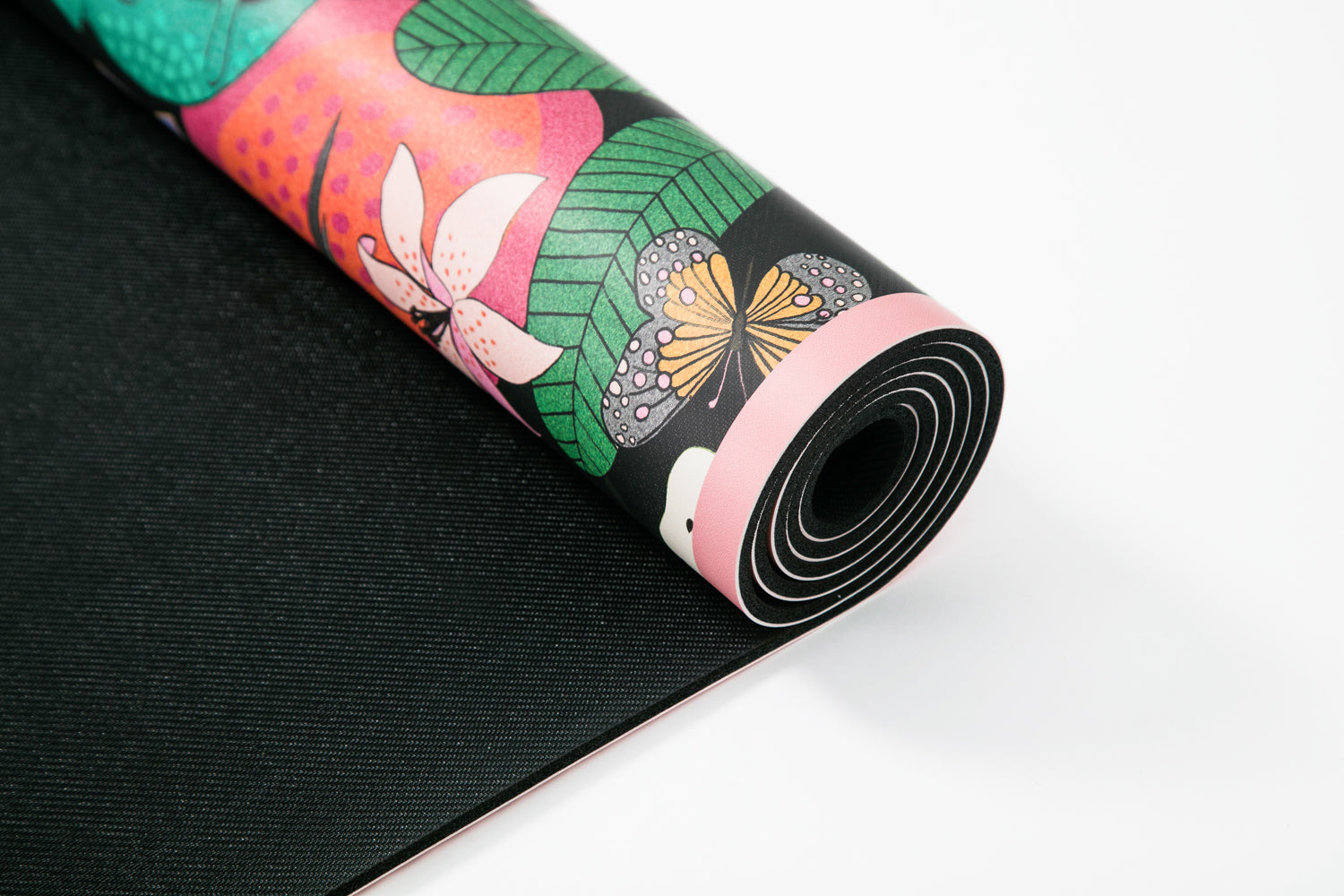 The Spotty Paradise LUX PU Yoga Mat featuring vibrant flora and fauna design, perfect for yoga enthusiasts.