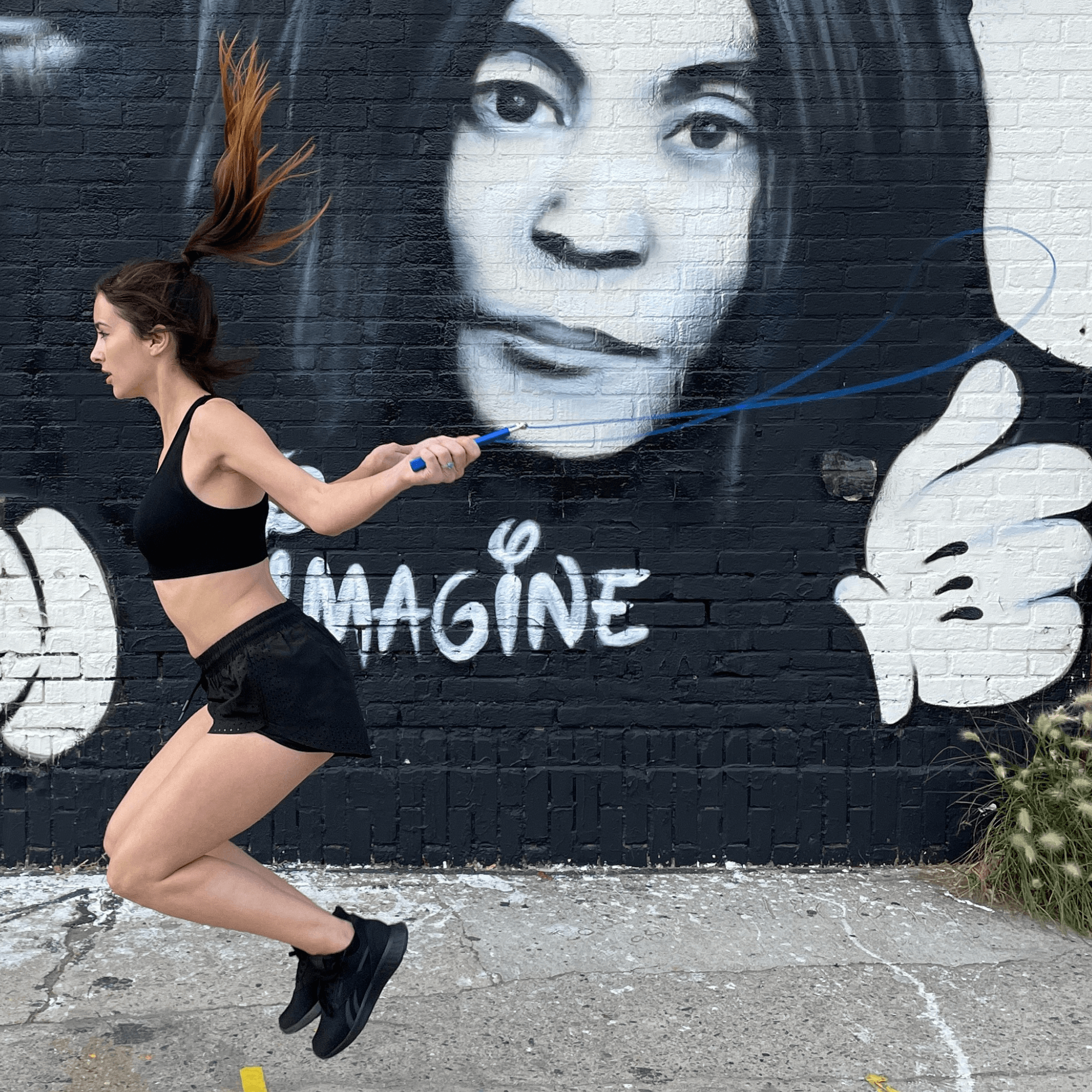 A weighted jump rope with adjustable steel wire cable, featuring sure-grip handles and a compact design for portable workouts.