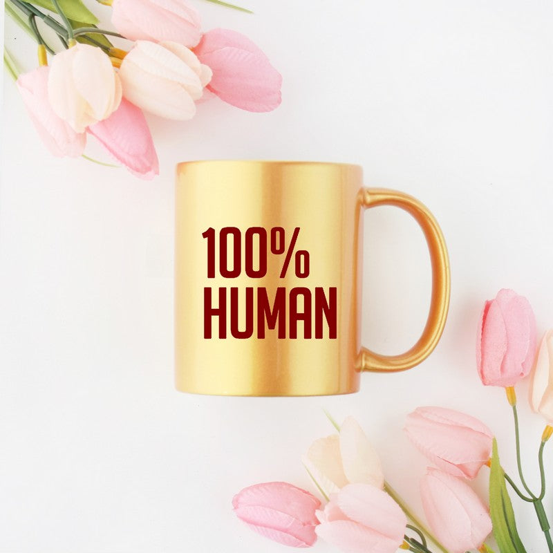 A luxurious 100% Human Golden & Silver Mug made of ceramic with a gold metallic coating, showcasing its elegant design.