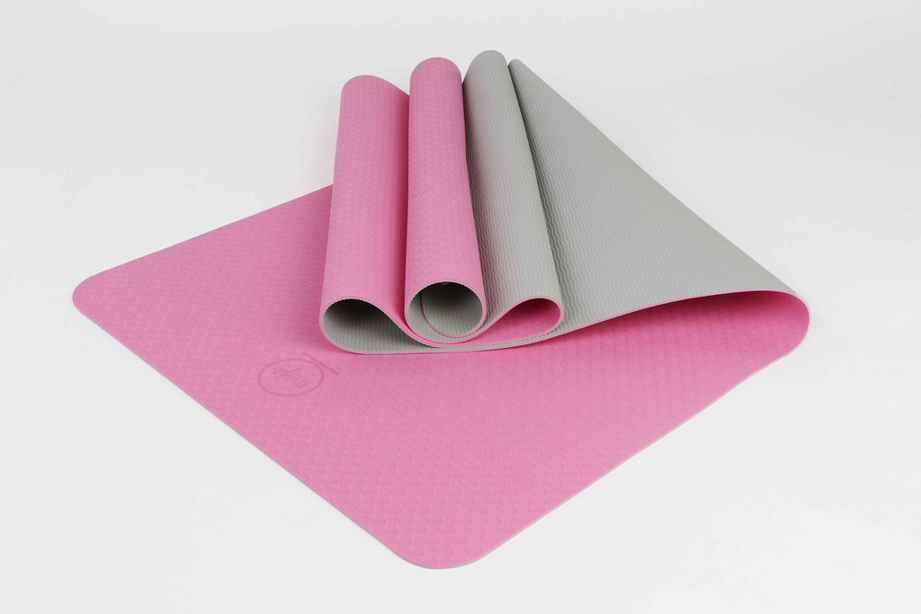 2 Tone TPE Premium Yoga Mat featuring a reversible embossed pattern in vibrant colors, designed for stability and comfort during yoga practice.