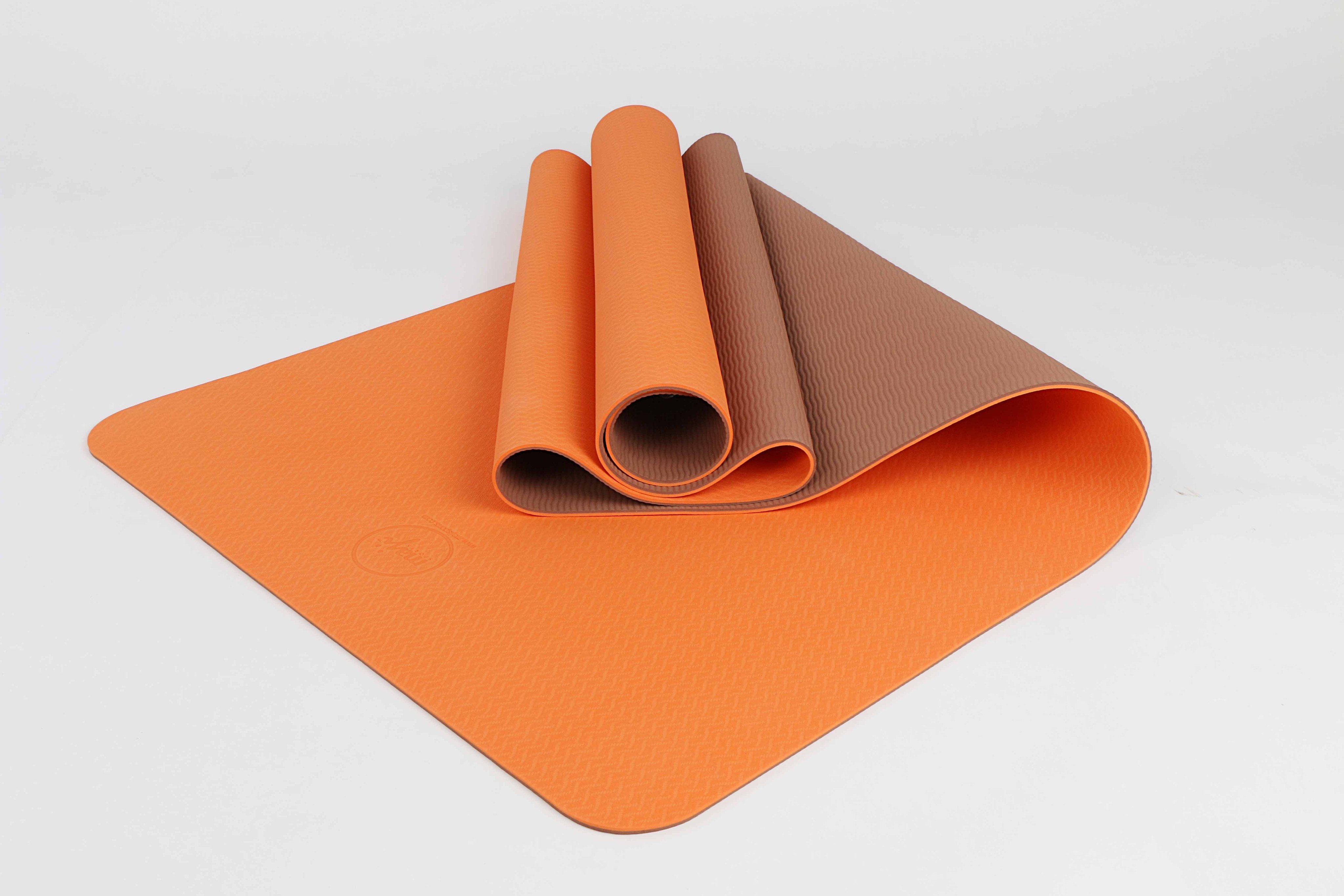 2 Tone TPE Premium Yoga Mat featuring a reversible embossed pattern in vibrant colors, designed for stability and comfort during yoga practice.