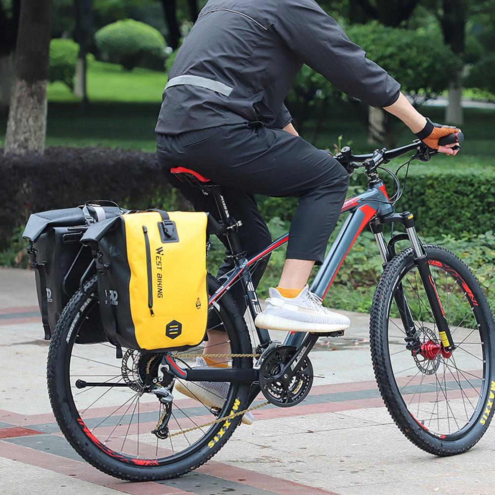 25L Waterproof Bicycle Carrier Bags mounted on a mountain bike rear seat rack, showcasing their spacious design and waterproof features.