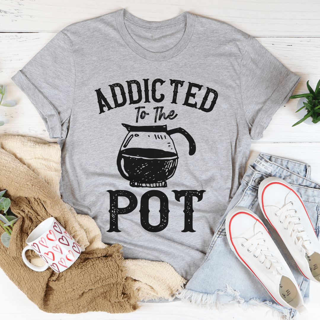 Addicted To The Pot Tee featuring a playful slogan on a soft cotton fabric, showcasing its durability and stylish design.