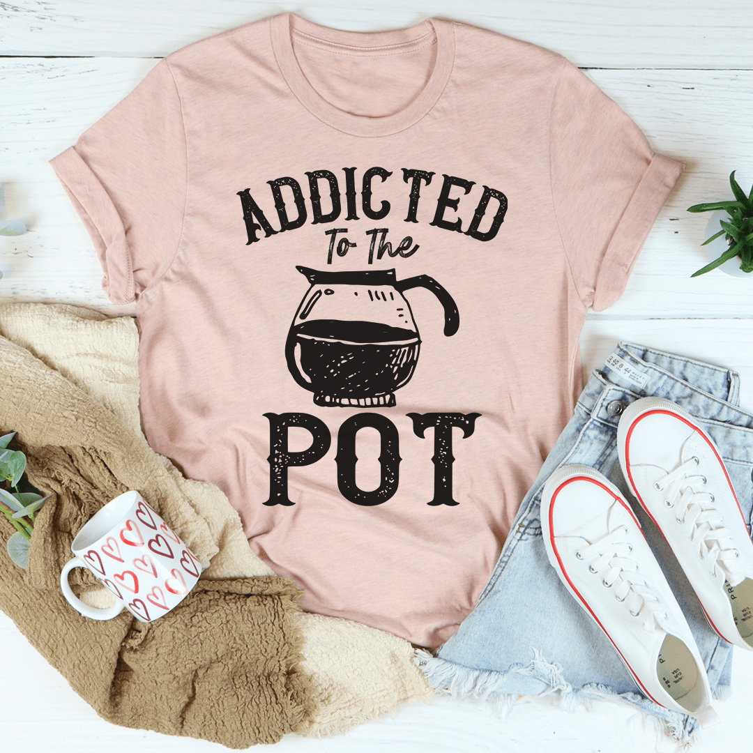 Addicted To The Pot Tee featuring a playful slogan on a soft cotton fabric, showcasing its durability and stylish design.