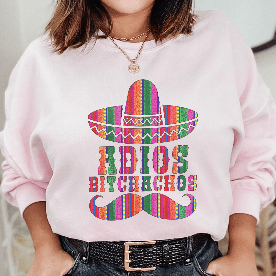 Adios Bitchachos sweats featuring unique artistic designs, made from cozy cotton/poly fleece blend with adjustable cuffs.