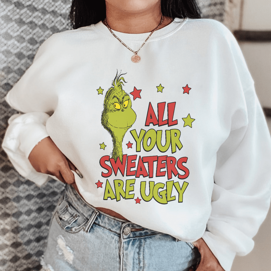 A stylish sweater featuring unique designs by various artists, showcasing creativity and individuality.