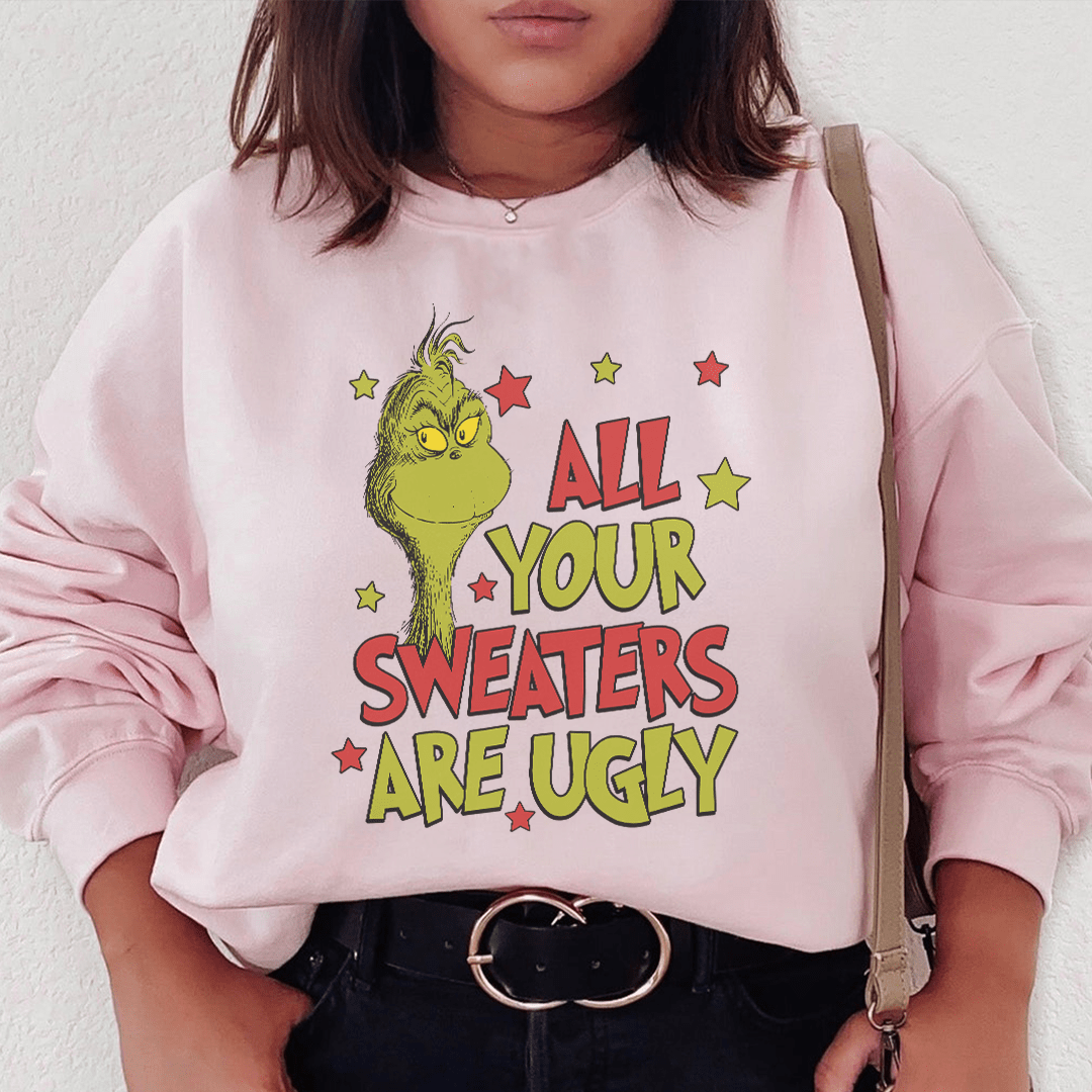 A stylish sweater featuring unique designs by various artists, showcasing creativity and individuality.