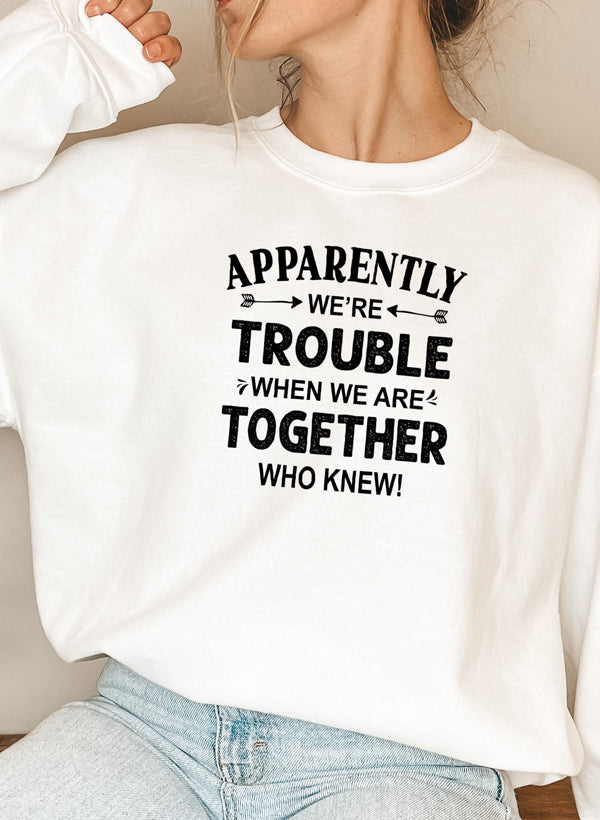 A cozy Apparently We're Trouble Sweat Shirt featuring a unique design, made from a soft cotton/poly fleece blend, perfect for casual wear.