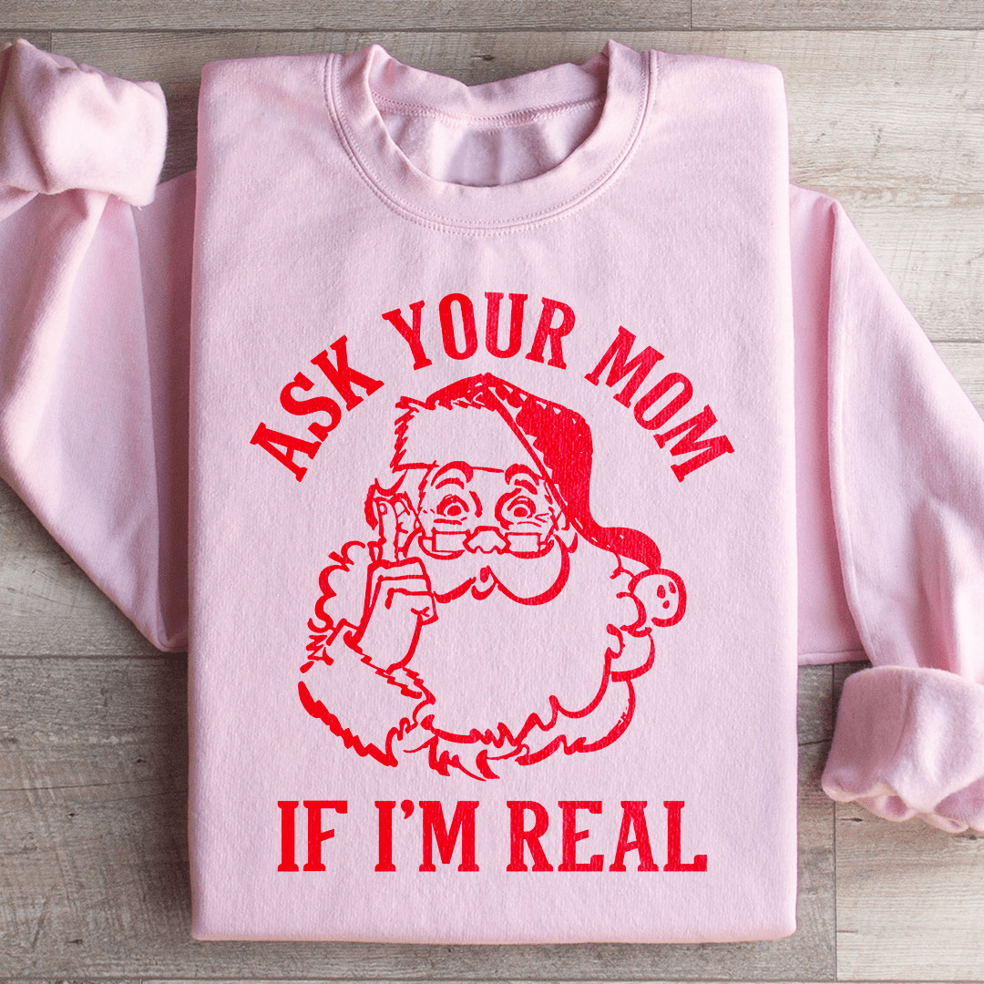 A cozy sweatshirt featuring the phrase 'Ask Your Mom If I'm Real', designed by top artists, showcasing a unique and stylish look.