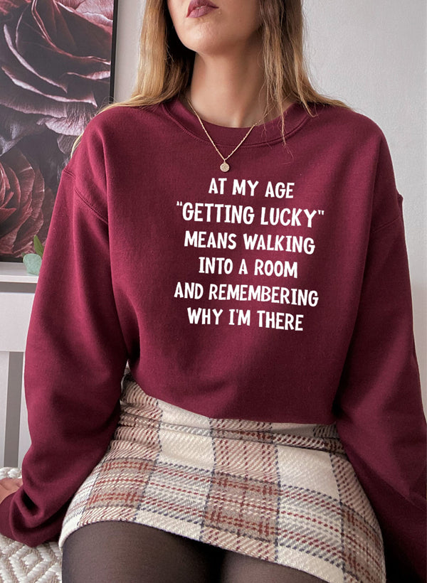 At My Age Getting Lucky Sweat Shirt featuring a cozy fleece lining and adjustable cuffs, designed by top artists.