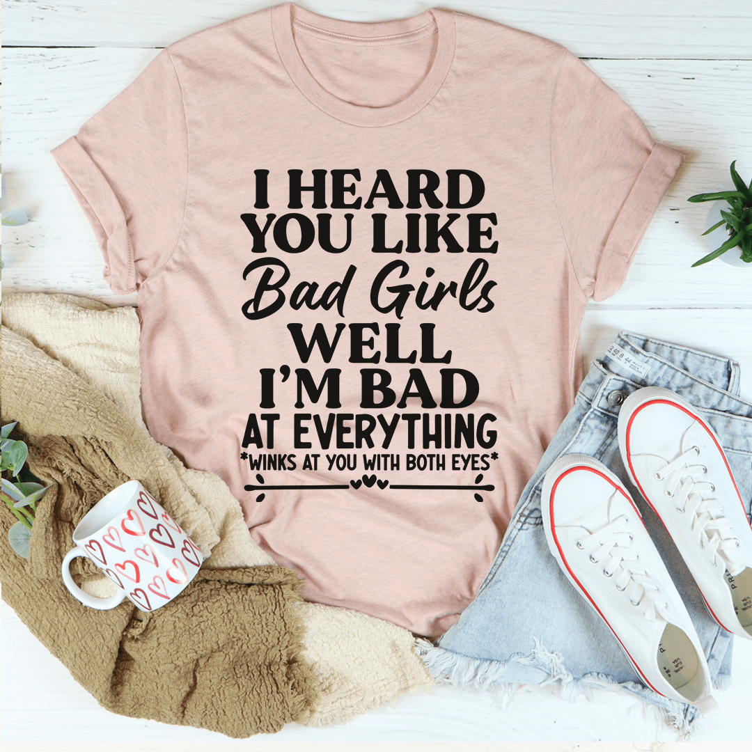 A stylish Bad Girls Tee made from soft ring-spun cotton, featuring double stitching for durability and a vibrant printed design.