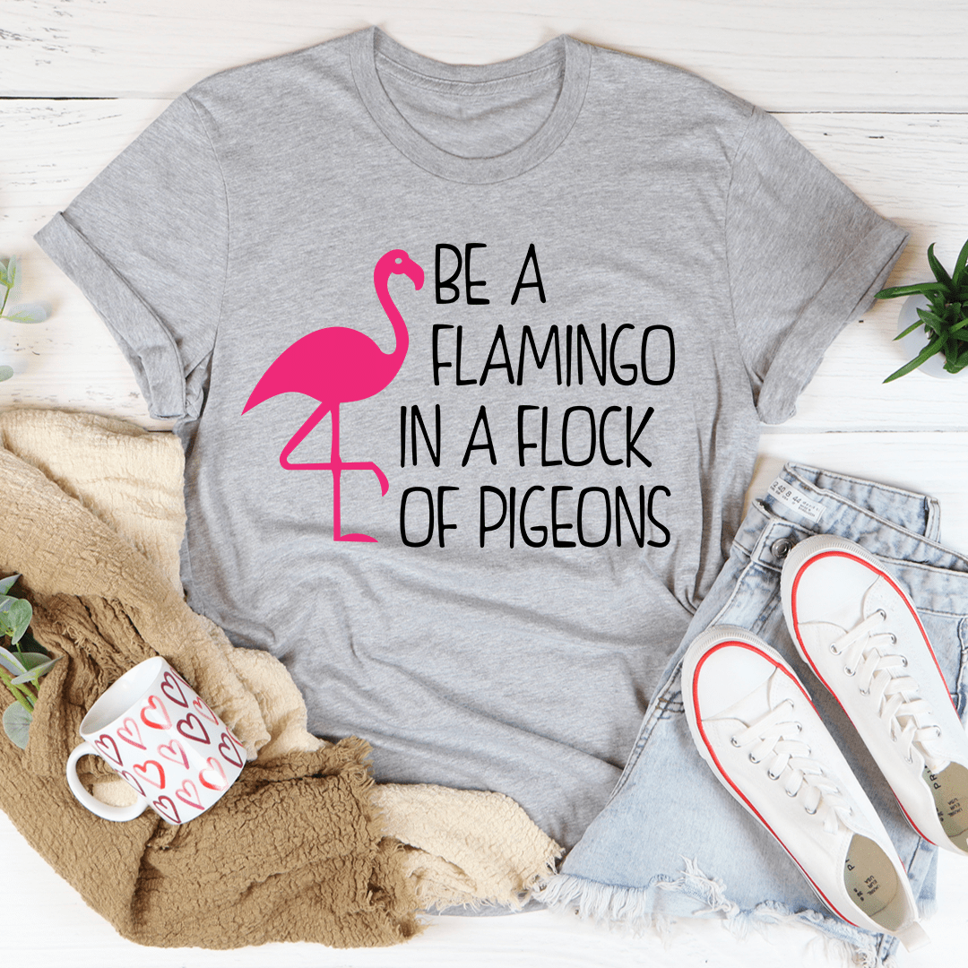 Be A Flamingo In A Flock Of Pigeons T-Shirt featuring vibrant colors and a comfortable fit, perfect for casual wear.