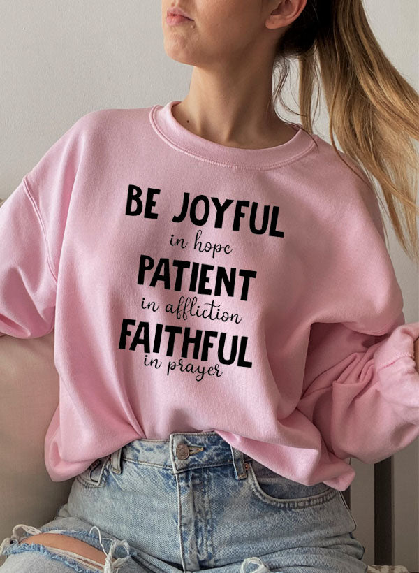 Be Joyful In Hope Patient In Affliction Faithful In Prayer Sweatshirt featuring a cozy fleece lining and inspirational text design.