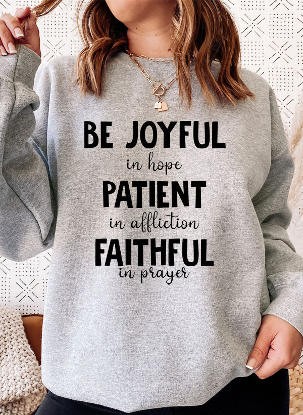 Be Joyful In Hope Patient In Affliction Faithful In Prayer Sweatshirt featuring a cozy fleece lining and inspirational text design.