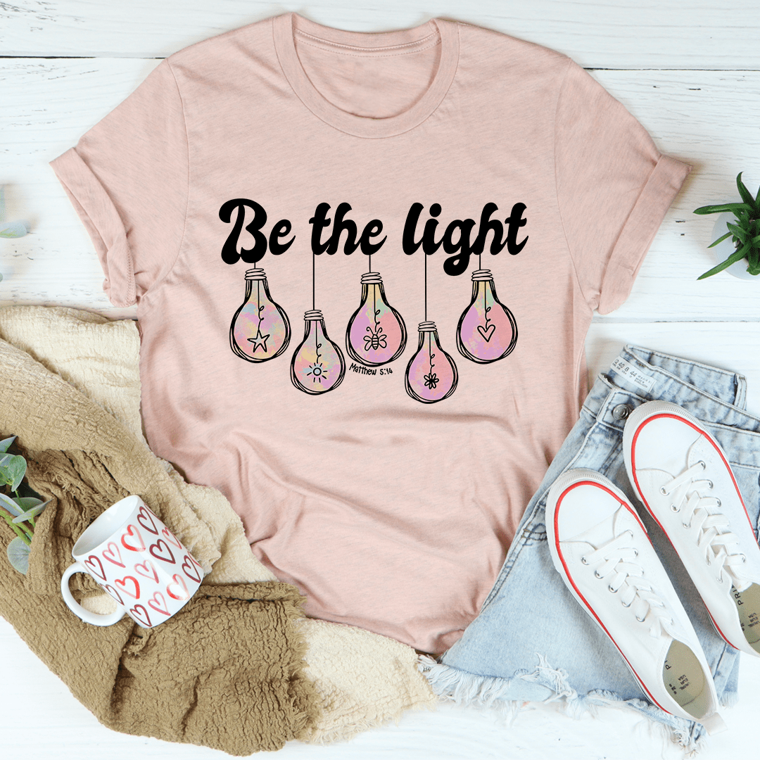 Be The Light Matthew 5:14 T-Shirt made of soft cotton, featuring double stitching for durability and an inspirational design.