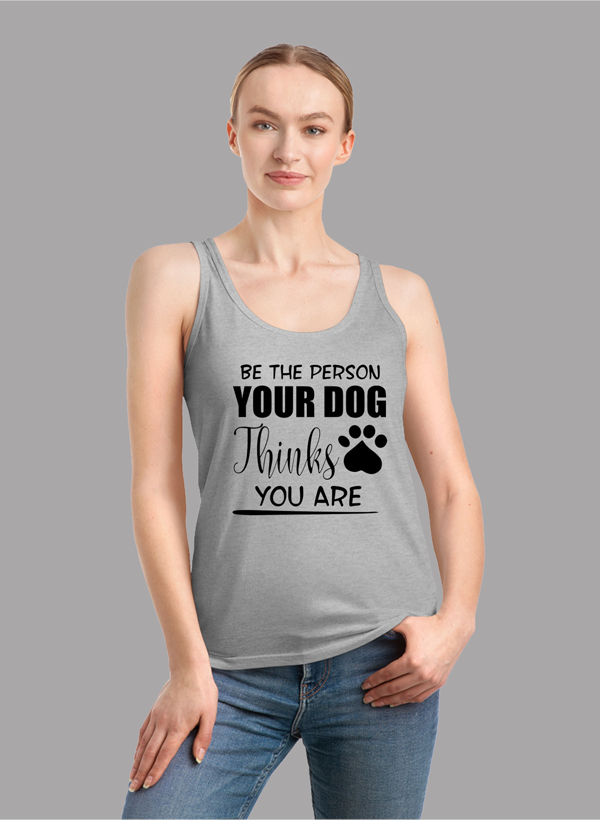 A stylish women's tank top featuring the phrase 'Be The Person Your Dog Thinks You Are', designed for comfort and performance.