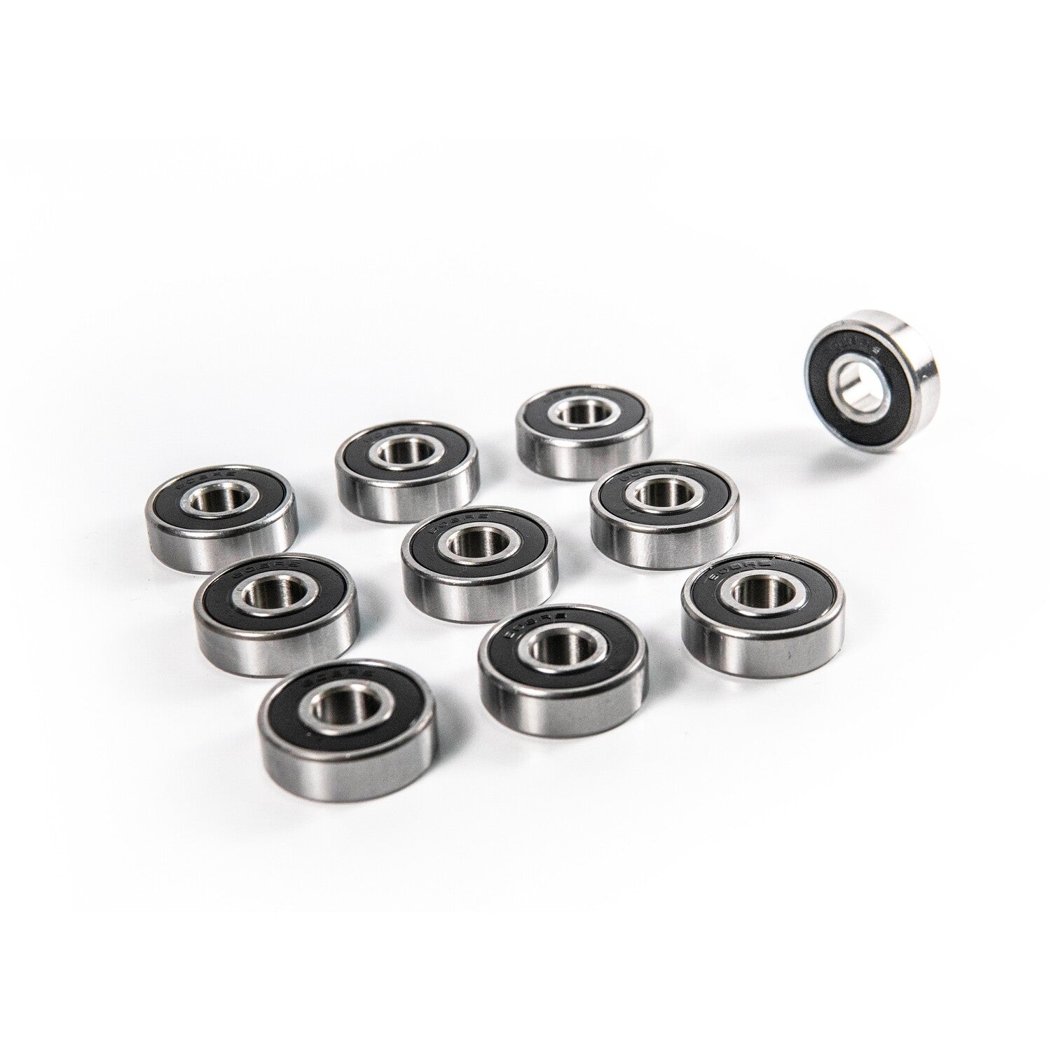 High-performance skateboard bearings designed for ultra-smooth rides and durability, featuring chrome steel balls and removable rubber shields.