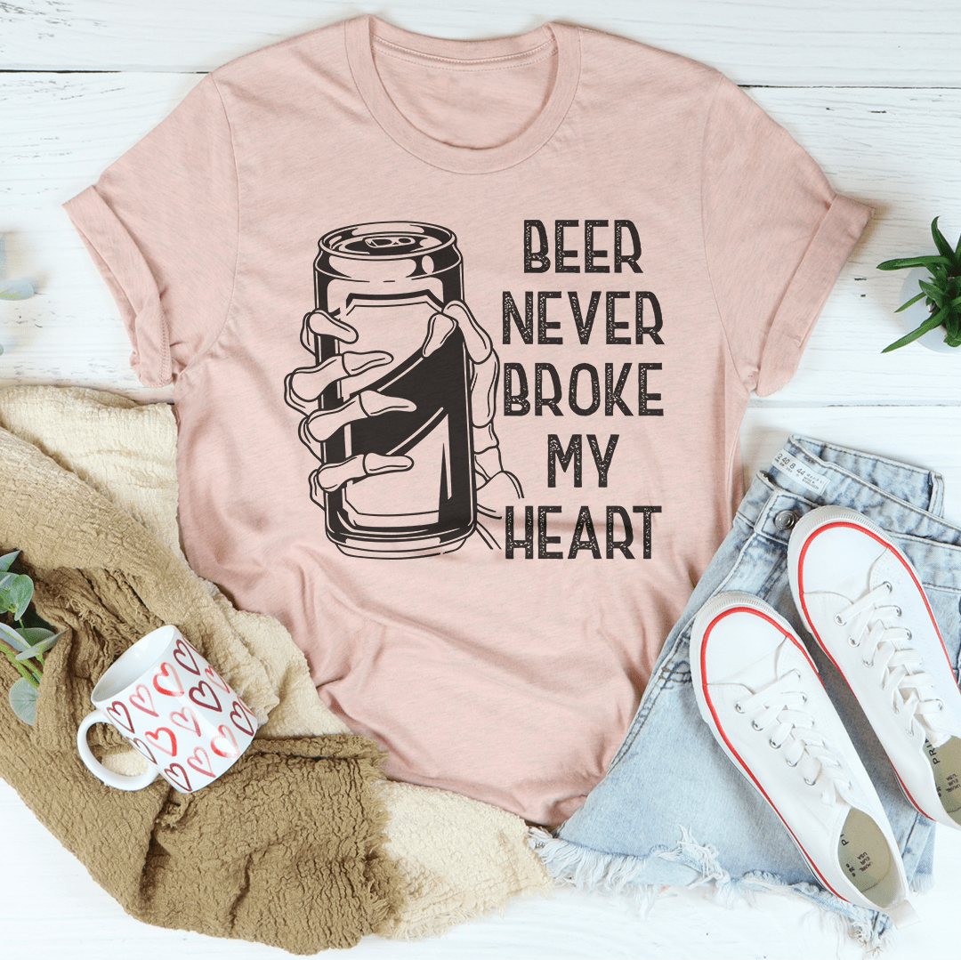 Beer Never Broke My Heart Skull Tee featuring a unique skull design on a soft cotton fabric.