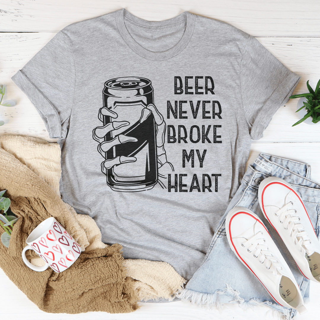 Beer Never Broke My Heart Skull Tee featuring a unique skull design on a soft cotton fabric.