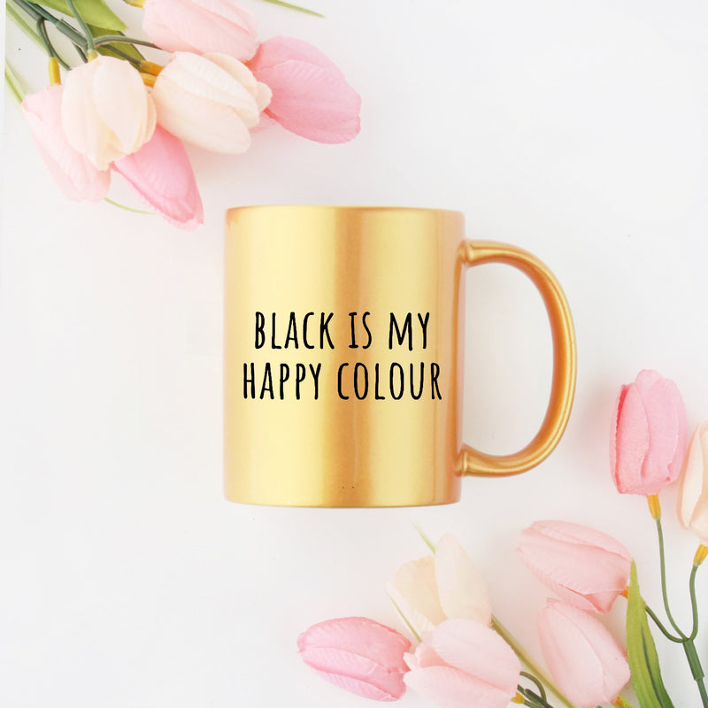 Elegant black ceramic mug with gold metallic coating, featuring the phrase 'Black Is My Happy Colour' in stylish typography.