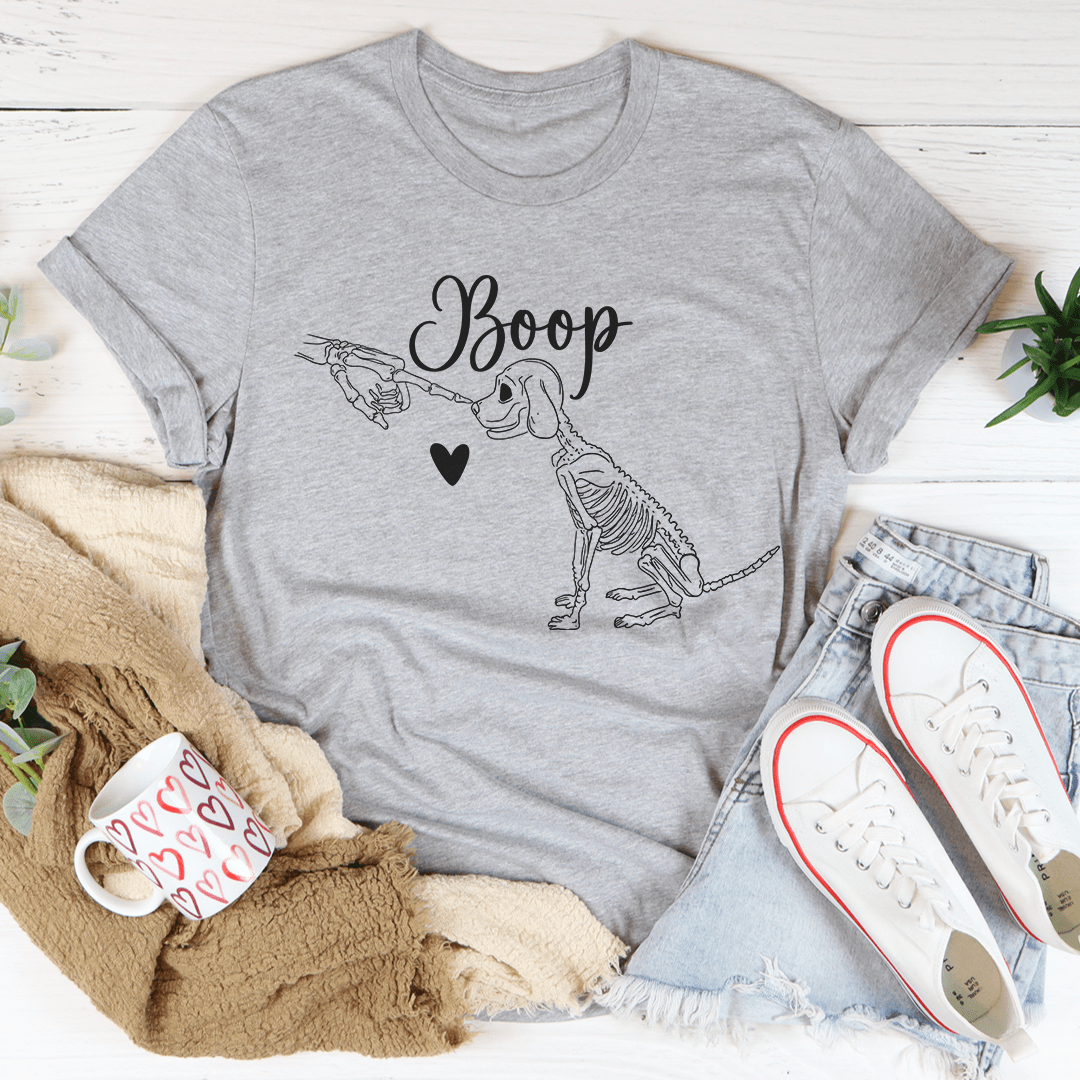 A cute dog-themed t-shirt featuring a playful design, made from soft ring-spun cotton with double stitching for durability.