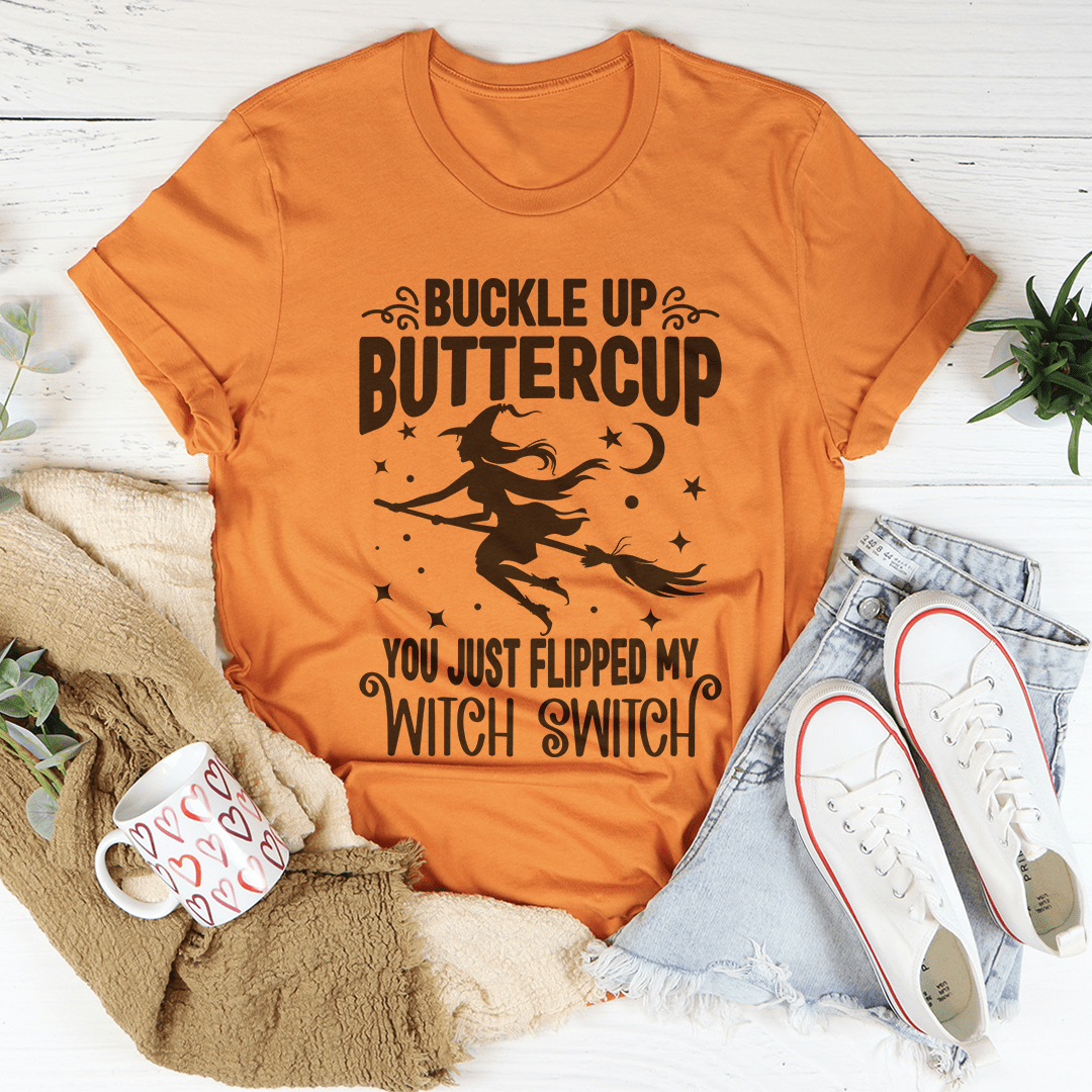 Buckle Up Buttercup You Just Flipped My Witch Switch T-Shirt displayed on a mannequin, showcasing its vibrant design and soft fabric.