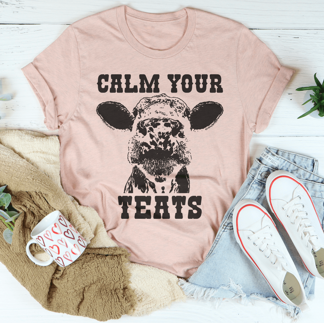 Calm Your Teats T-Shirt in various colors, showcasing its soft cotton fabric and durable stitching.