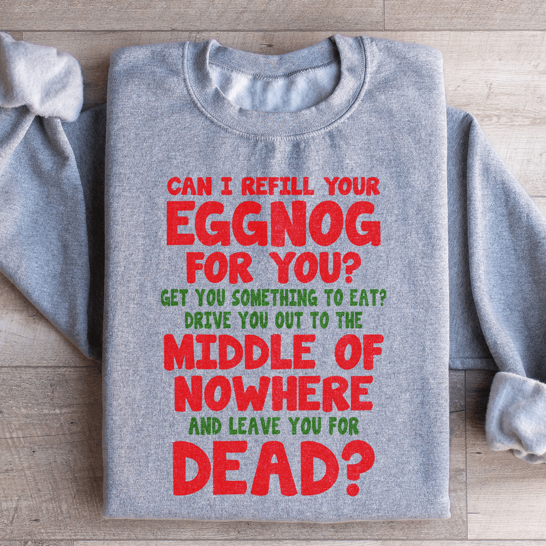 Cozy 'Can I Refill Your Eggnog' hoodie featuring a festive design, made from a soft cotton/poly fleece blend.