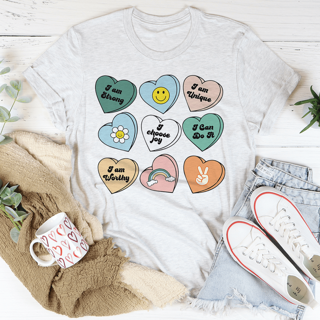 Candy Hearts Positivity Affirmations T-Shirt featuring vibrant colors and affirmations, made from soft ring-spun cotton.