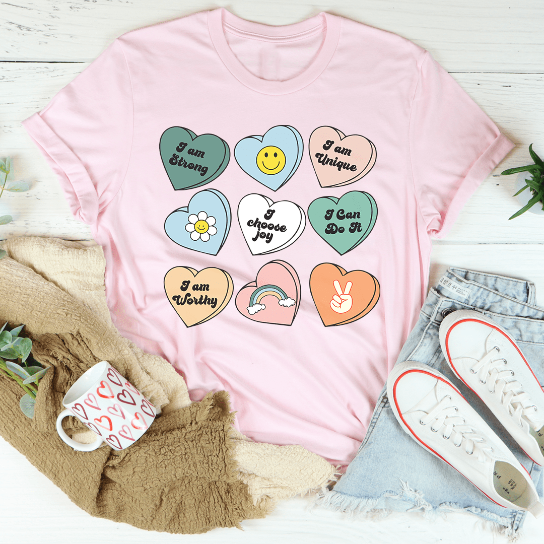 Candy Hearts Positivity Affirmations T-Shirt featuring vibrant colors and affirmations, made from soft ring-spun cotton.