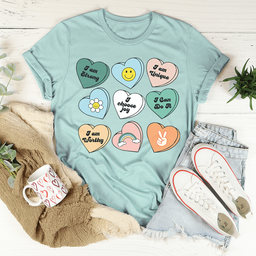 Candy Hearts Positivity Affirmations T-Shirt featuring vibrant colors and affirmations, made from soft ring-spun cotton.