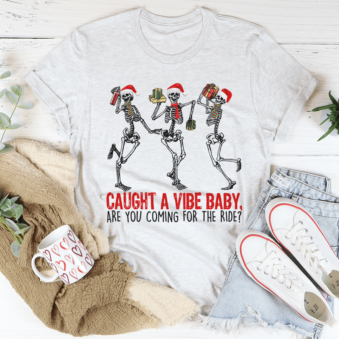 Caught A Vibe Baby T-Shirt in various colors, showcasing its soft cotton fabric and stylish design.