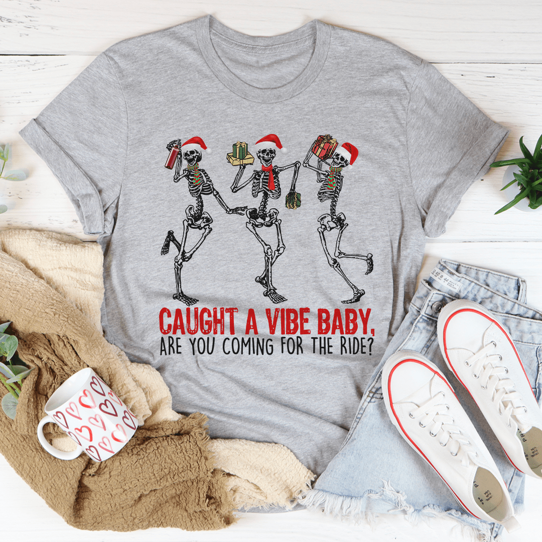 Caught A Vibe Baby T-Shirt in various colors, showcasing its soft cotton fabric and stylish design.