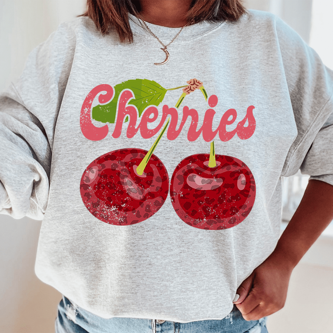 Cozy Cherries hoodie made from cotton/poly fleece blend with adjustable cuffs.