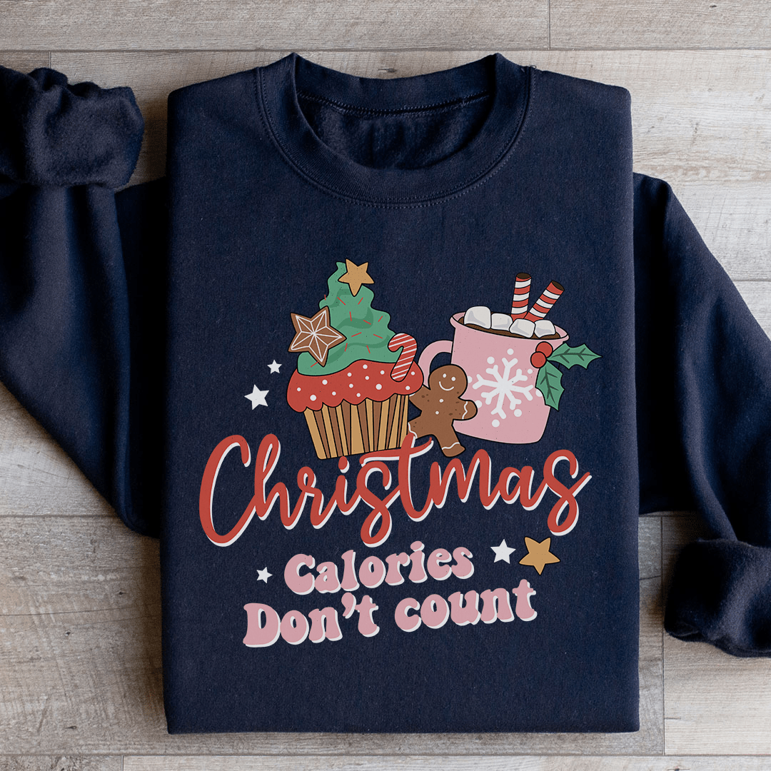 Cozy 'Christmas Calories Don't Count' sweats featuring a festive design, made from a soft cotton/poly fleece blend.