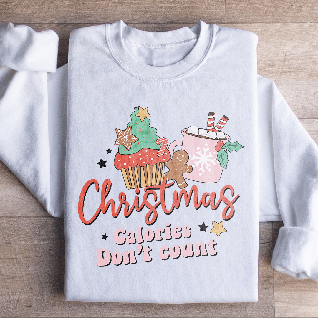 Cozy 'Christmas Calories Don't Count' sweats featuring a festive design, made from a soft cotton/poly fleece blend.