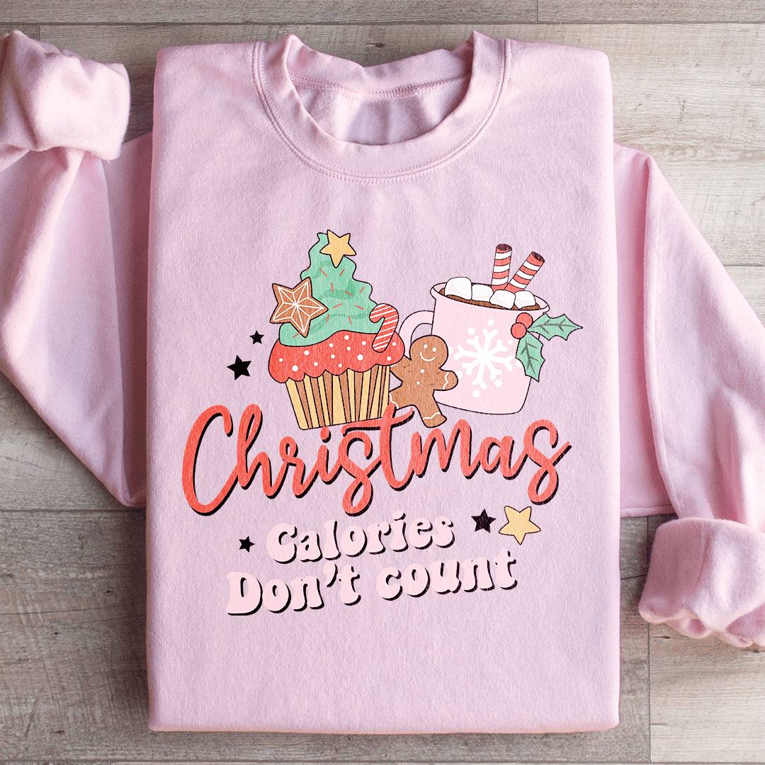 Cozy 'Christmas Calories Don't Count' sweats featuring a festive design, made from a soft cotton/poly fleece blend.