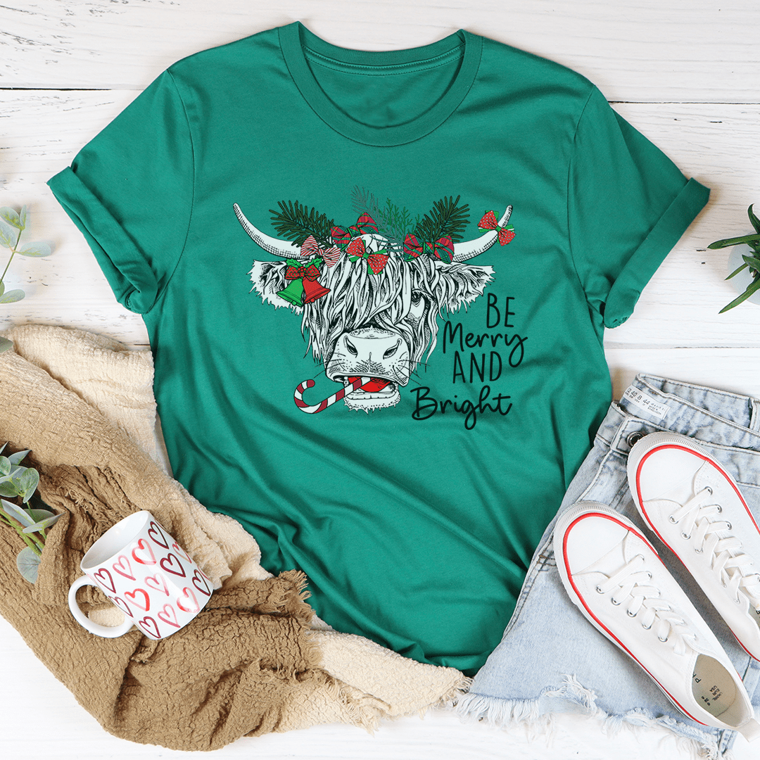 A festive Christmas Cow T-Shirt featuring a playful cow design, made from soft cotton with double stitching for durability.