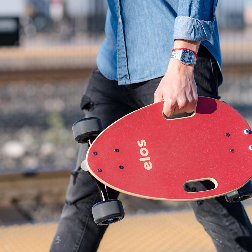 Complete Skateboard in Maroon Red, showcasing its sleek design and lightweight build, perfect for commuting and recreational use.